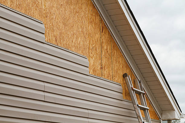 Professional Vinyl Siding technician working in North East, PA